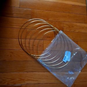 (6)   12 in goldtone floral hoops